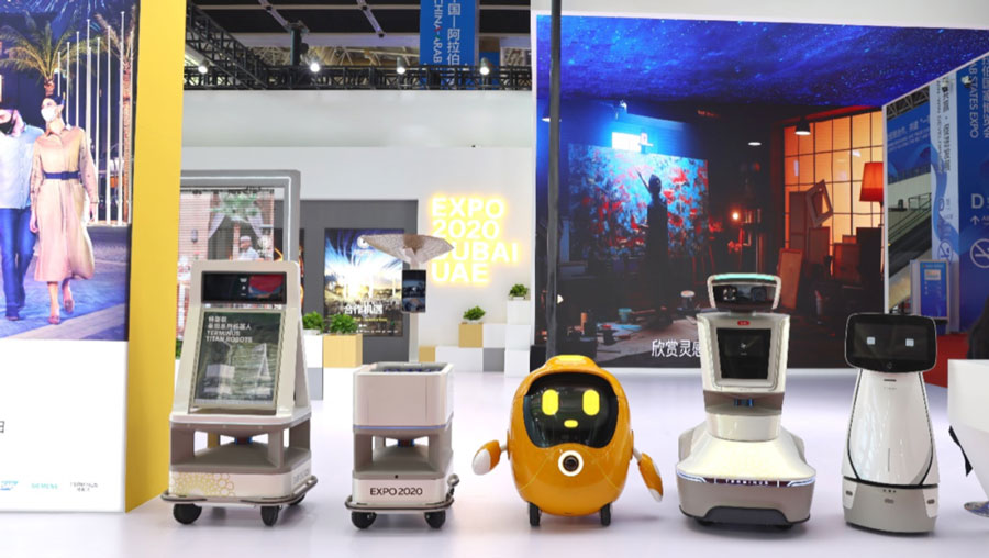 Opti made by Terminus Group, one of the official mascots of Expo 2020 Dubai, interacts with the visitors at the United Arab Emirates booth at the fifth China-Arab States Expo. /China Daily
