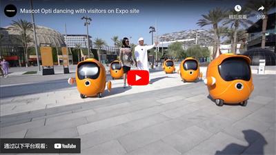 Mascot Opti dancing with visitors on Expo site