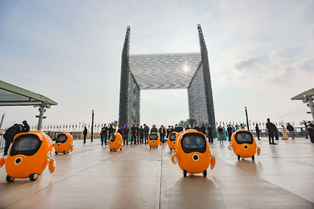 Expo-2020-Dubais-robot-mascot-Opti-performs-a-welcome-dance-as-his-developers.jpg